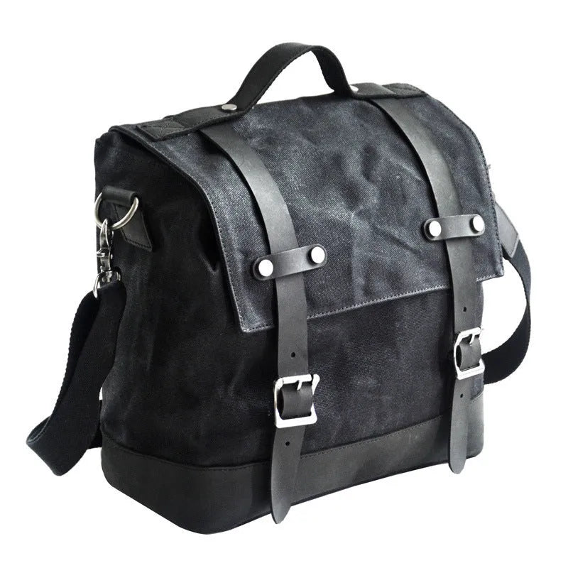 Thick waterproof canvas motorcycle side bag in black with cowhide top and adjustable straps
