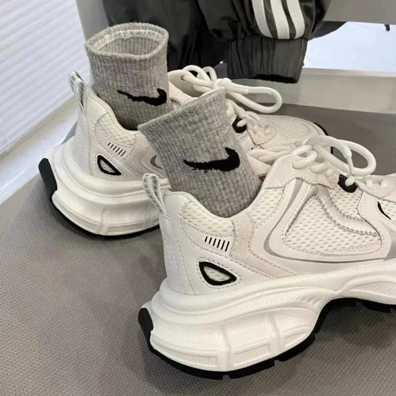 Beige mesh platform sports shoes with wedge heel and front lace-up closure on rubber sole