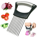 Stainless steel onion holder slicer with non-slip base on a kitchen counter, holding a tomato for slicing