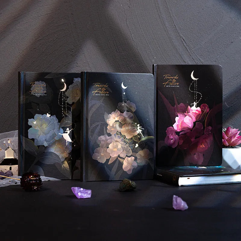 A5 notebook with luminous cover open to show pages with colour illustrations