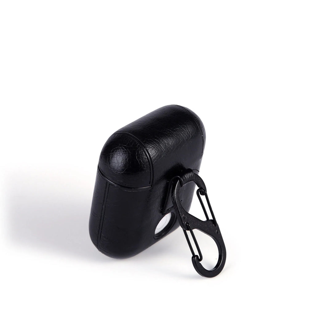 Genuine leather protective case for Apple Airpods in various colours showing charging port access.
