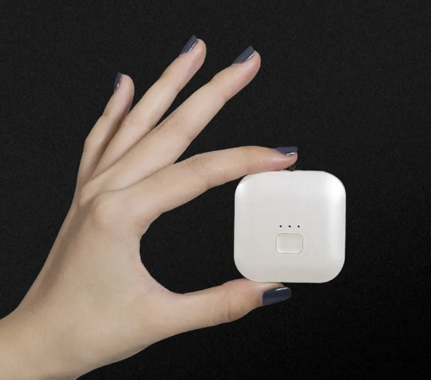 Compact pink USB air purifier necklace with negative ion technology and USB charging port