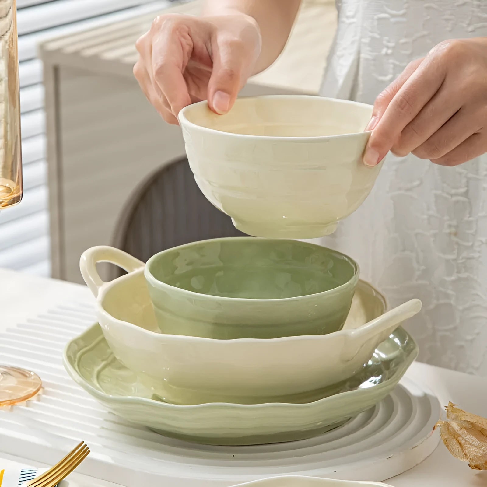 Seven-piece solid colour ceramic tableware set in a gift box, showing minimalist Japanese style plates and bowls.