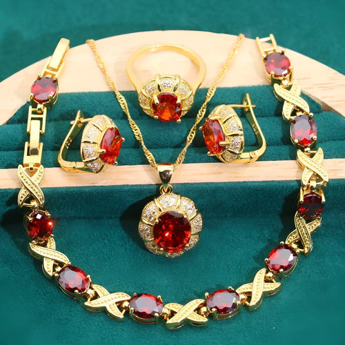 18k gold plated jewellery set with cubic zirconia stones, showing necklace, earrings, bracelet, and ring.