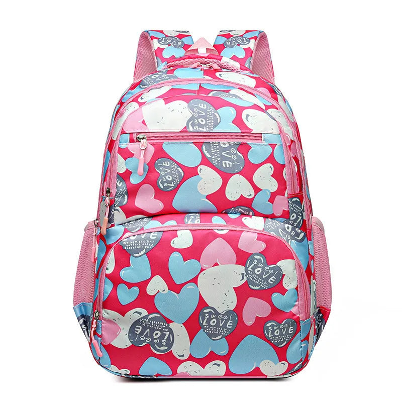 Blue children's school backpack with air pillow straps on a grey background.