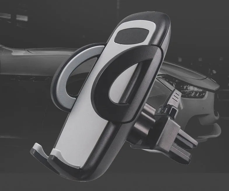 Black plastic car air vent mobile phone holder mounted on vehicle dashboard