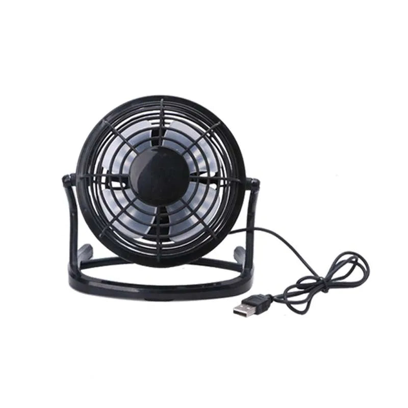Mini black USB desk fan with adjustable angle for laptop cooling on wooden desk