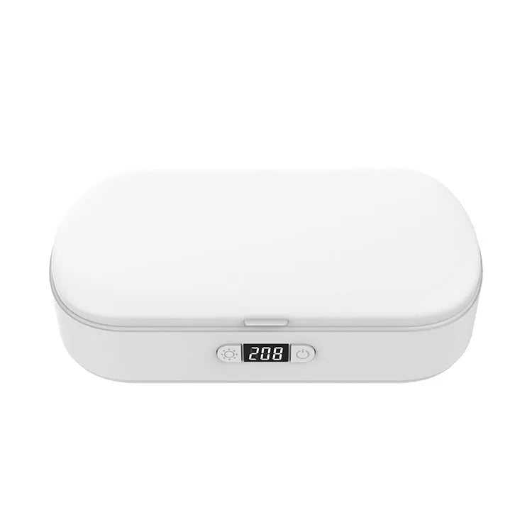 White portable UV steriliser box with wireless charging for phones and toothbrushes