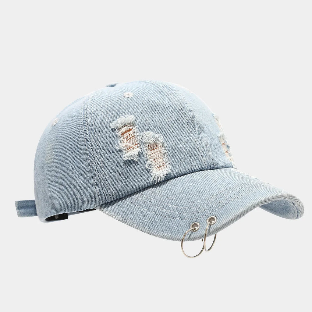 Men's adjustable denim peaked cap with dome crown in light blue jeans colour on a plain background