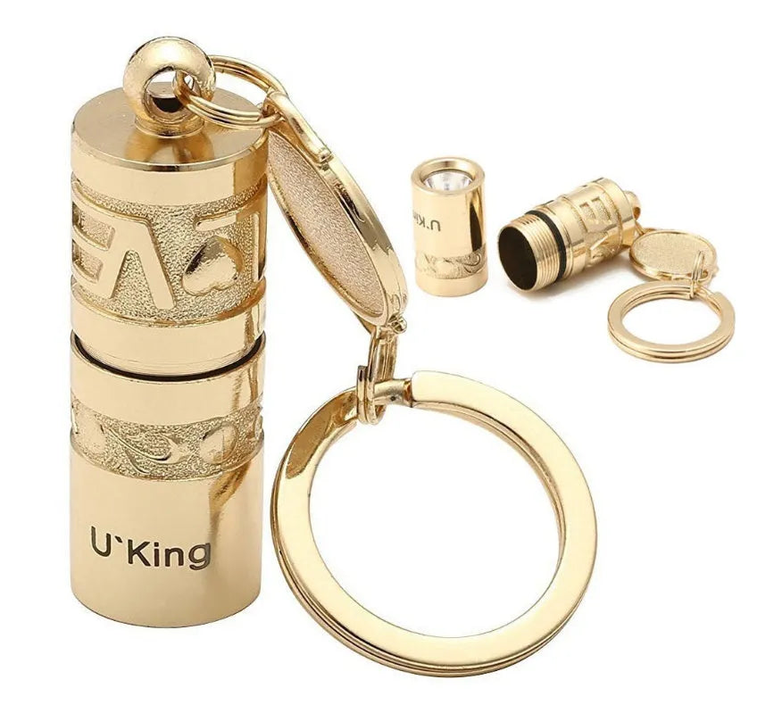 Gold zinc alloy waterproof LED flashlight keychain showing 7cm compact design