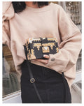 Women's hard PU shoulder bag with flap closure and rivet decoration in black or green