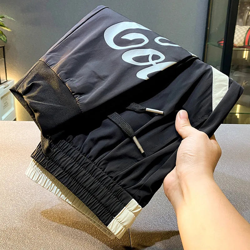 Man wearing black ultra-thin ice silk cotton ankle-banded cropped casual trousers