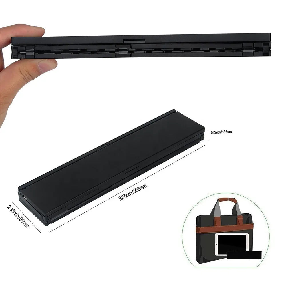 Black and white views of a folded mini wireless Bluetooth keyboard for tablets next to a smartphone.