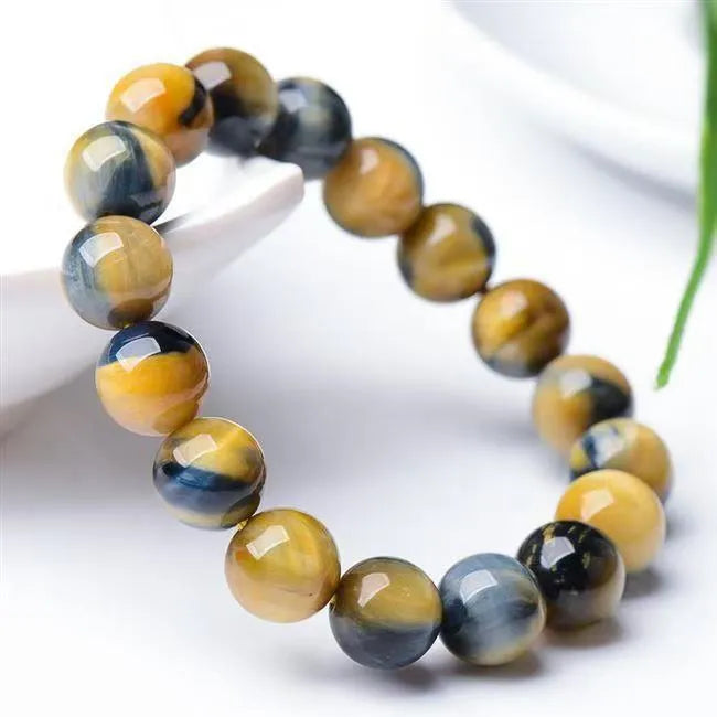 Natural agate fantasy tigereye round bead bracelet on white background, unisex handmade single-circle style