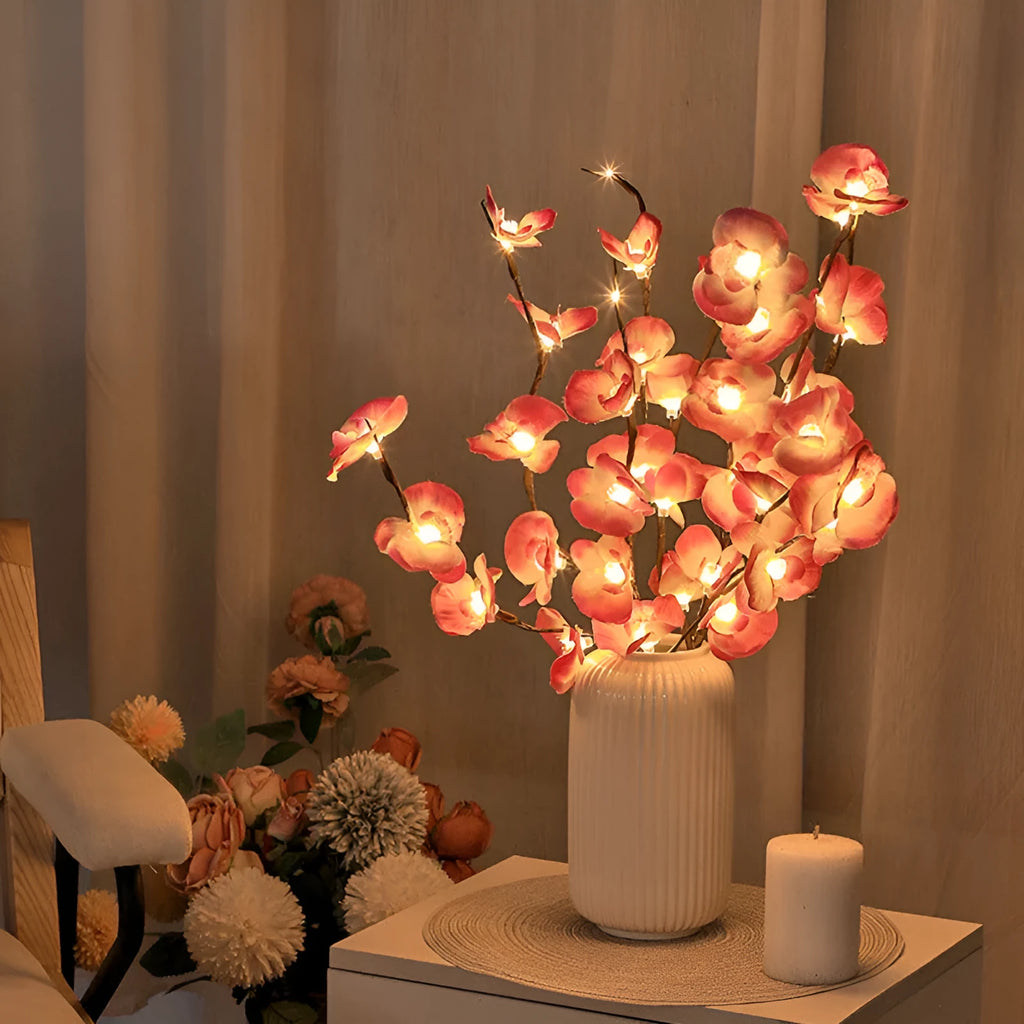 Pink LED phalaenopsis orchid branch decorative light, 65cm long with fabric blossoms.