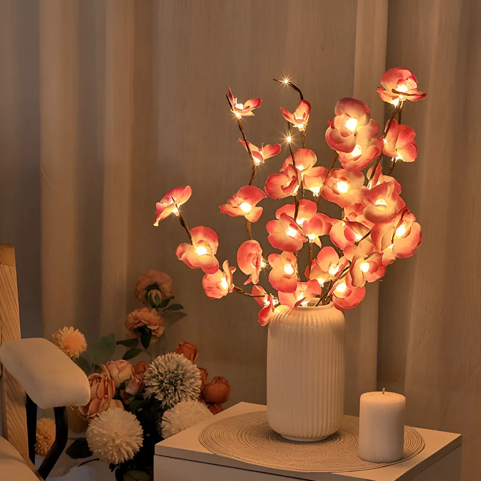 Pink LED phalaenopsis orchid branch decorative light, 65cm long with fabric blossoms.
