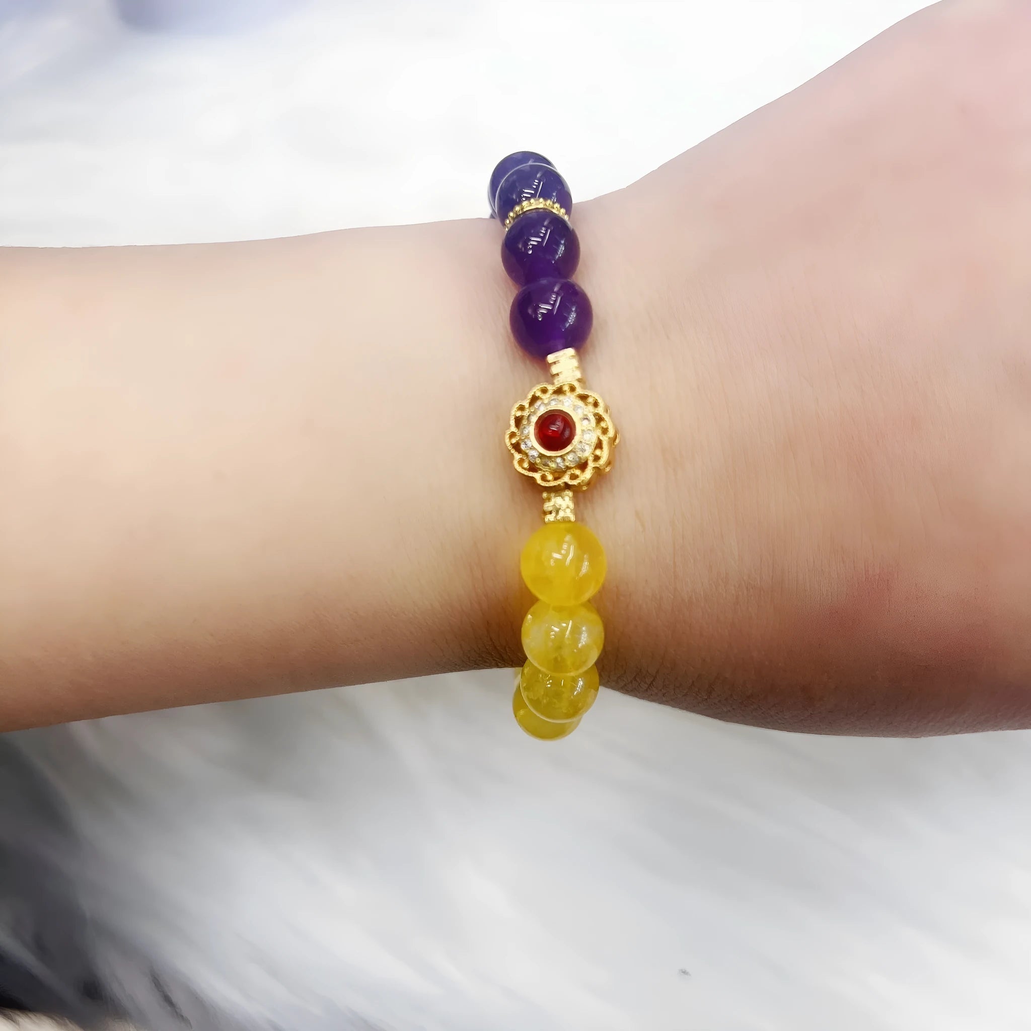 Handmade women's amethyst crystal bracelet with yellow and purple colour tones