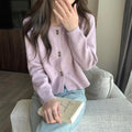 Women's acrylic cardigan sweater coat in milky white, shown with long sleeves and a cardigan front.
