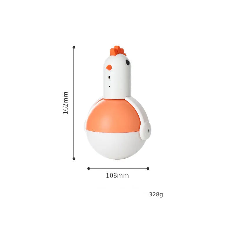 Green and orange electric cat toy with laser light feature on a wooden floor.