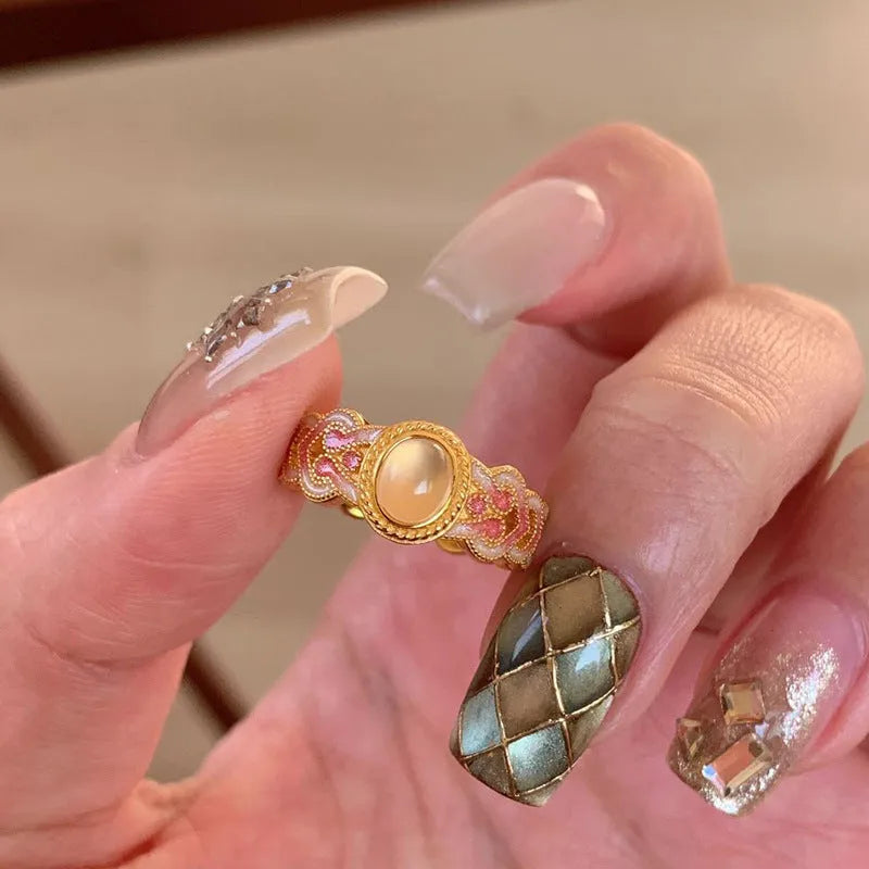 Open geometric ring with pink crystal enamel on copper gold plating for women