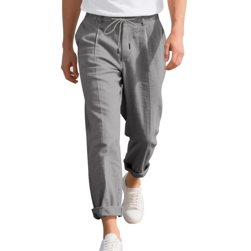 Men's linen casual trousers in light khaki colour with loose straight-leg fit and drawstring waist