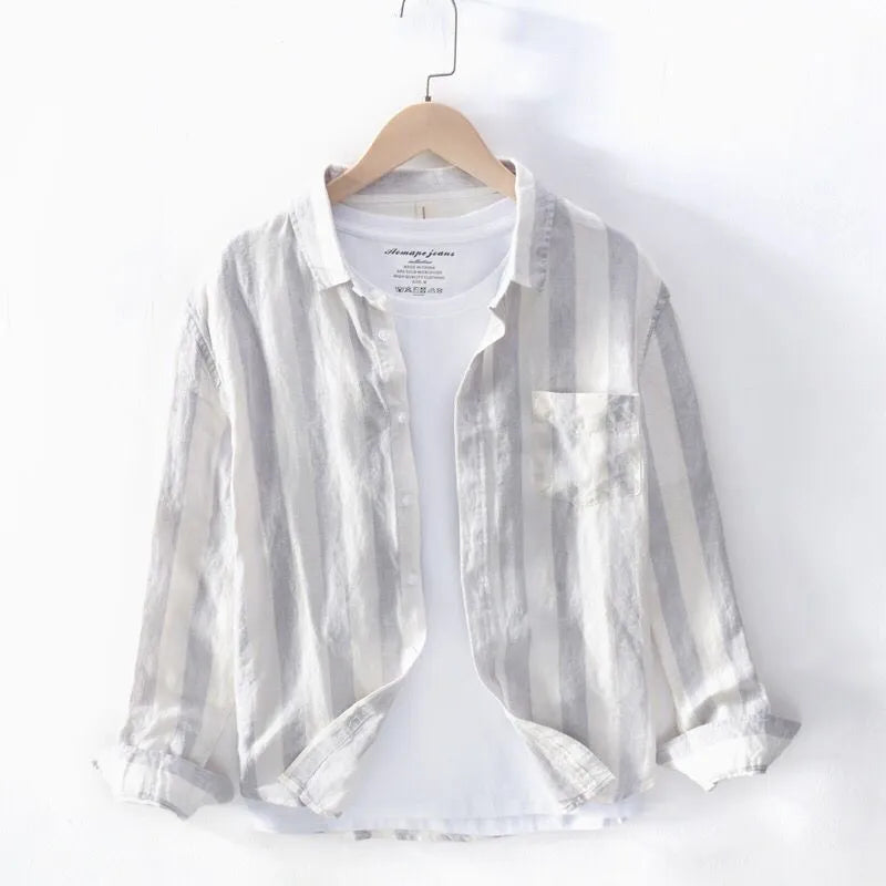 Men's long sleeve Hong Kong style casual shirt in light grey, showing loose fit and button front.