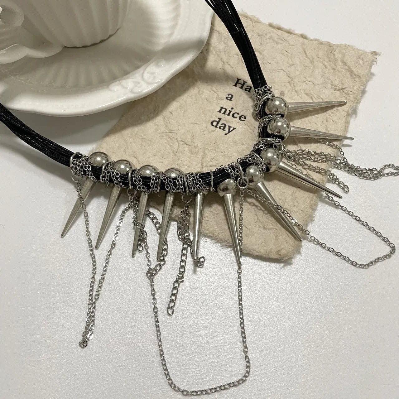 Rivet round beads winding tassel necklace with leather cord and electroplated details