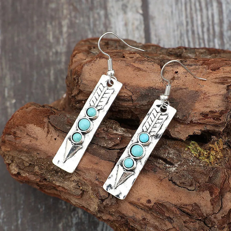 Women's silver geometric retro earrings with inlaid turquoise detailing on long strip design
