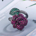 Geometric black gold women's ring with simulated red corundum stone and flower design elements