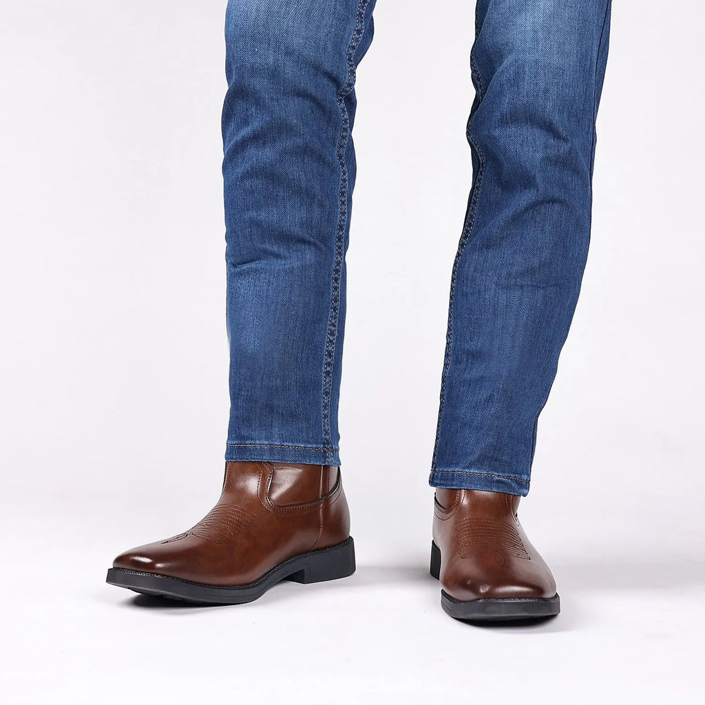 Men's brown retro cowboy boots with wide square toe, horseshoe heel, and embroidered sewing thread detailing on upper