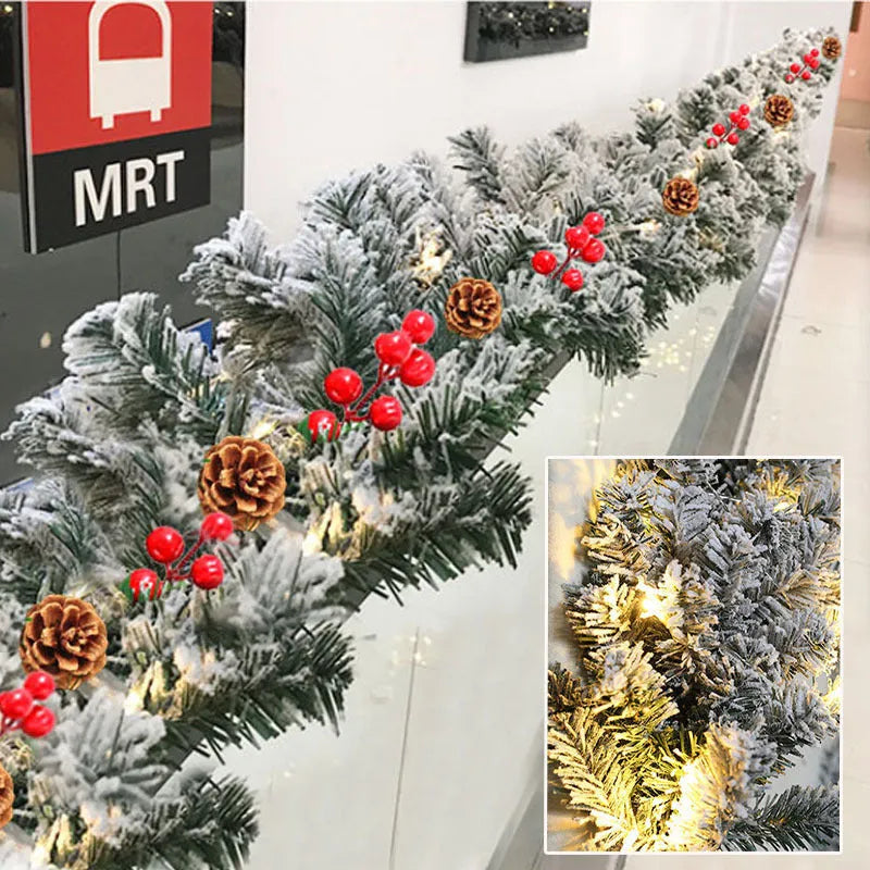 Flocked snow PVC rattan Christmas garland in 1.8 metre length on a mantelpiece with fairy lights