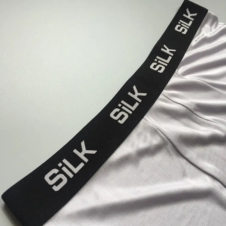 Men's silk shorts in loose fit design showing navy blue, silver grey, and skin colour options