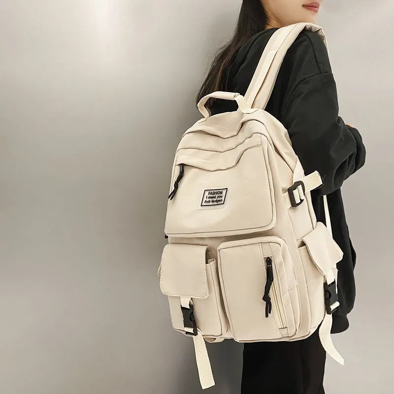 Soft nylon student backpack in black with a three-dimensional front pocket.