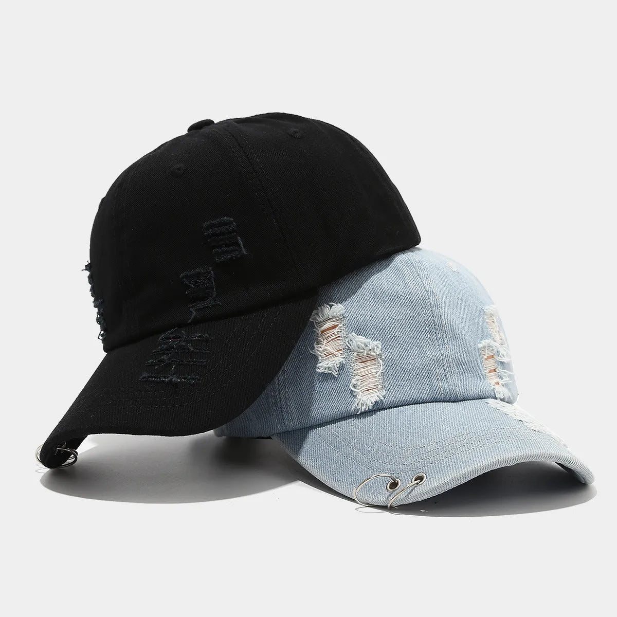Men's adjustable denim peaked cap with dome crown in light blue jeans colour on a plain background