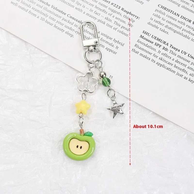 Mobile phone earphone bag pendant keychain with fruit designs including apple, strawberry, and apple core patterns