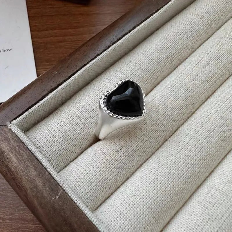 S925 sterling silver adjustable ring with black agate heart stone on finger
