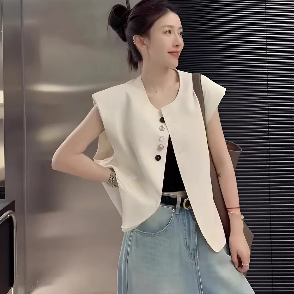 Women's loose fit polyester vest with pockets in milky white colour showing front view