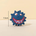Set of four colourful natural latex squeaky dog balls with cute faces on a blue, green, red, and yellow background