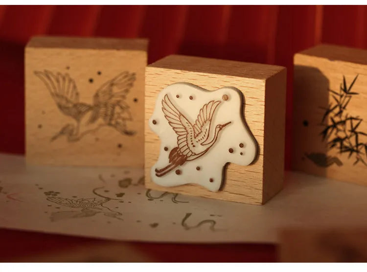 Mr. Paper wooden stamp set with four crane designs on a white background