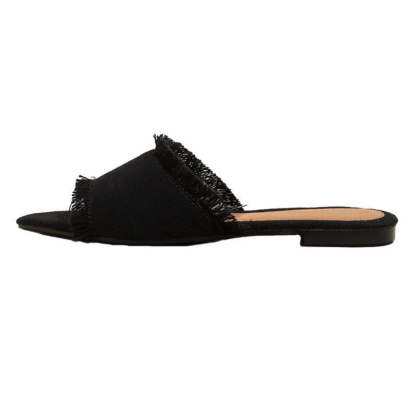 Women's casual denim flat slippers with a tassel detail and leather lining, shown in apricot colour.