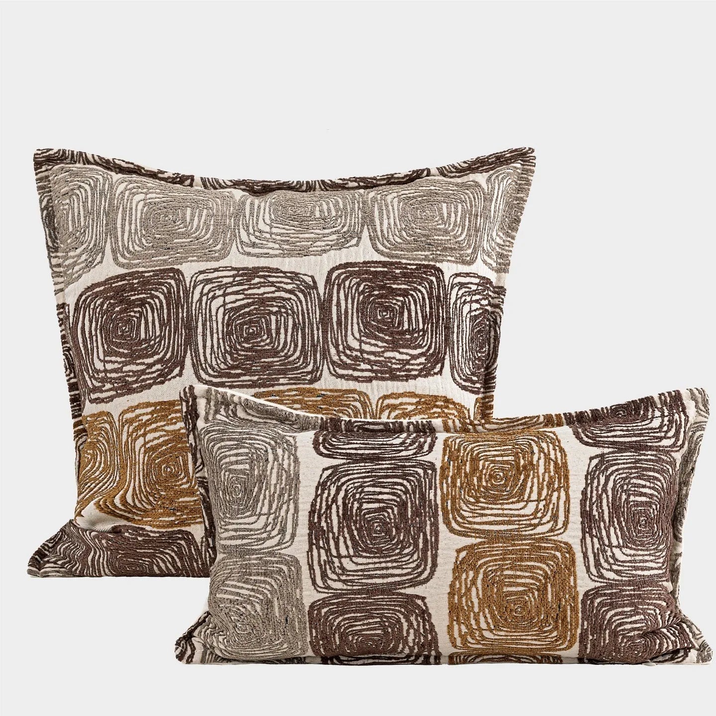 Abstract coil pattern cushion cover in cream and coffee colours, shown in square and rectangular sizes