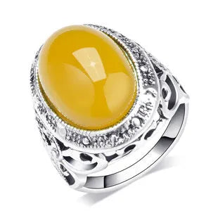Retro geometric alloy ring with antique silver amber electroplating showing fluorescent beeswax elements