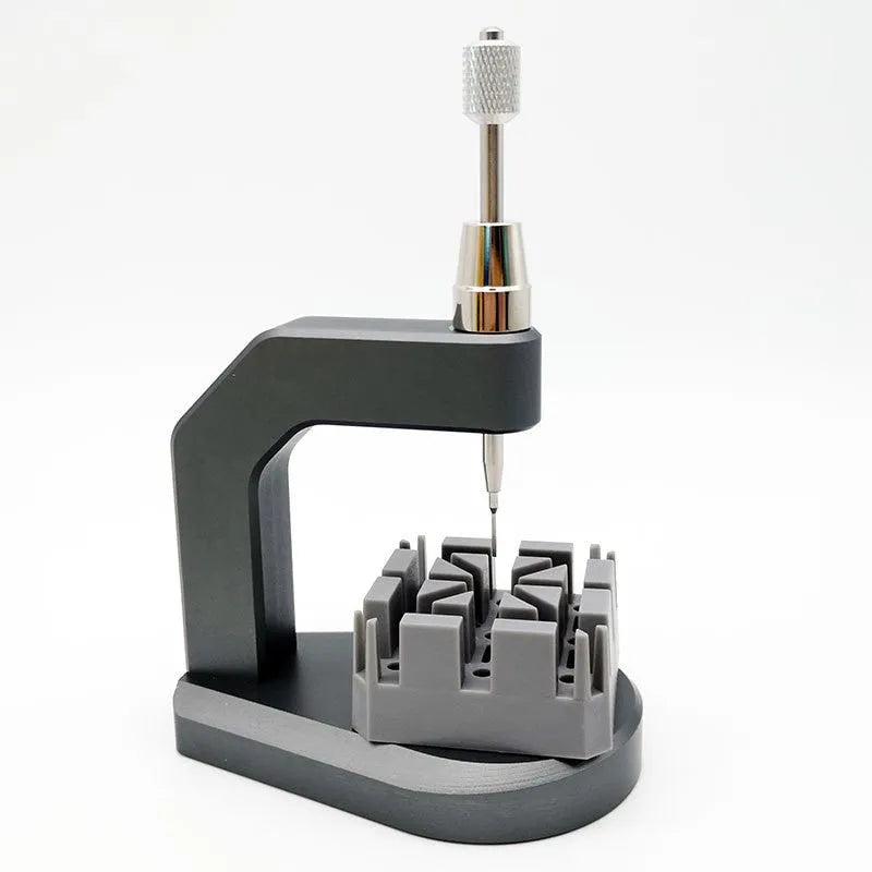 Silver tool steel multi-purpose press strap removal tool for watch and jewellery repair.