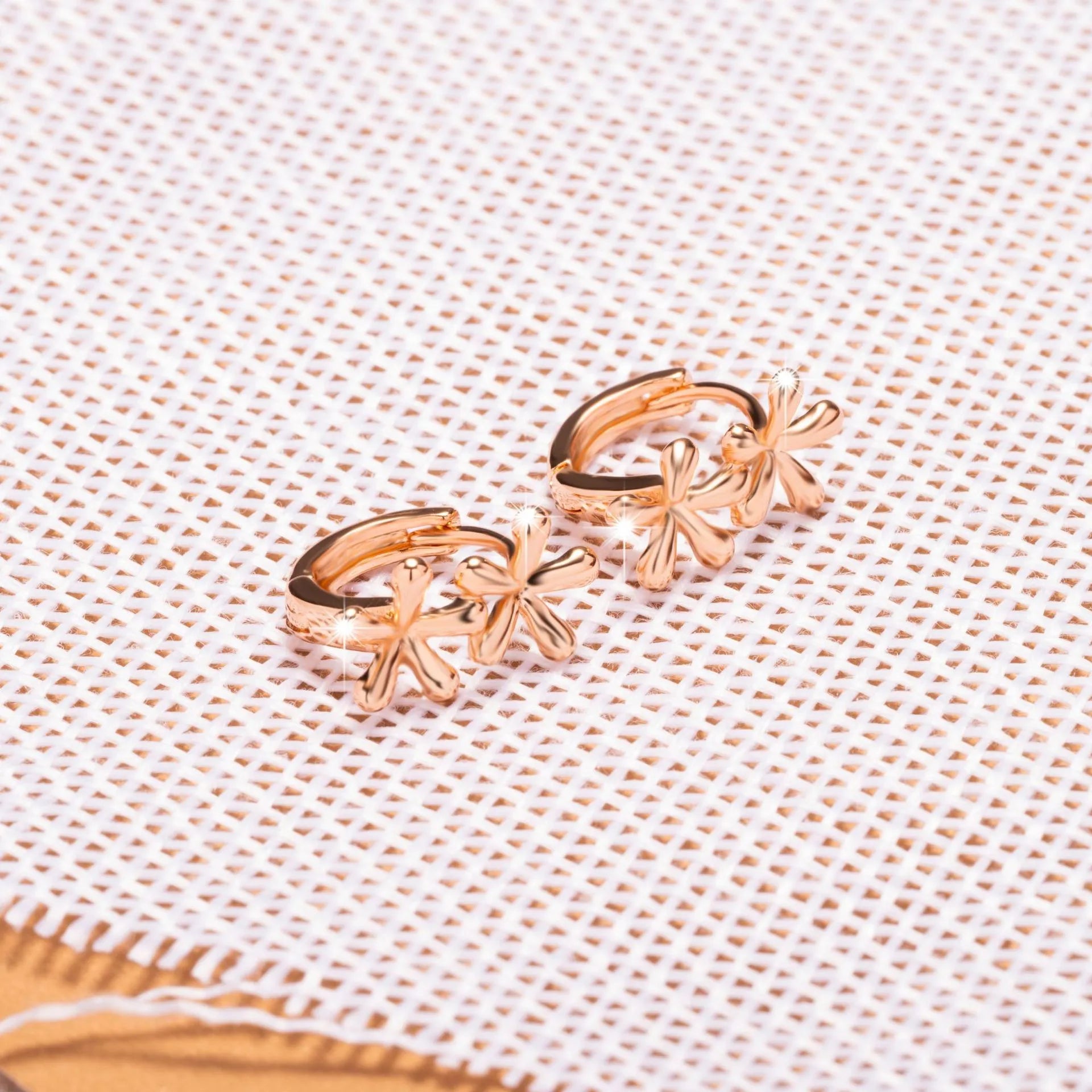 Rose gold electroplated earrings with circular waterdrop flower design