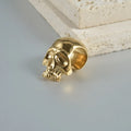 Stainless steel hollow skull Buddha earrings showing four electroplated colour options