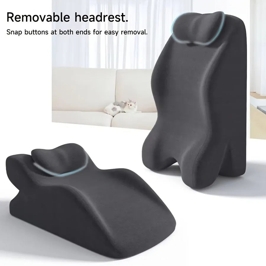 A stomach sleeper pillow shown in light grey, designed for prone positions and reading in bed.