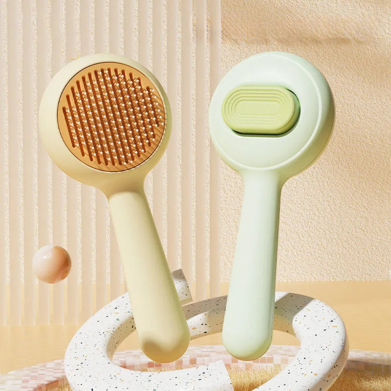 Green and yellow stainless steel cat grooming brushes with non-slip handles