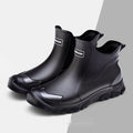Pair of solid colour PVC rain boots with flat heel and round head, size 36-48, non-slip sole
