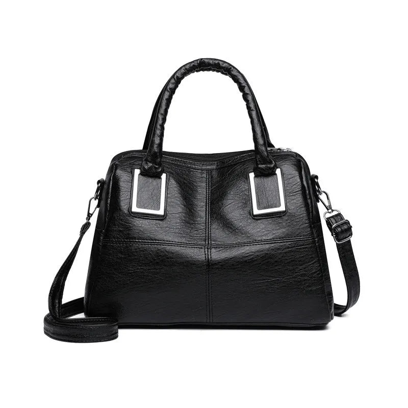Women's large capacity square shoulder bag in neutral colour with interior phone and file pockets.