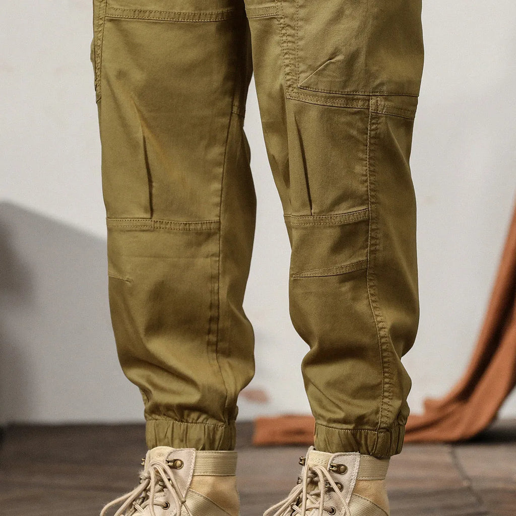 Men's cotton tapered harem pants in black colour with ankle bands and zip fly